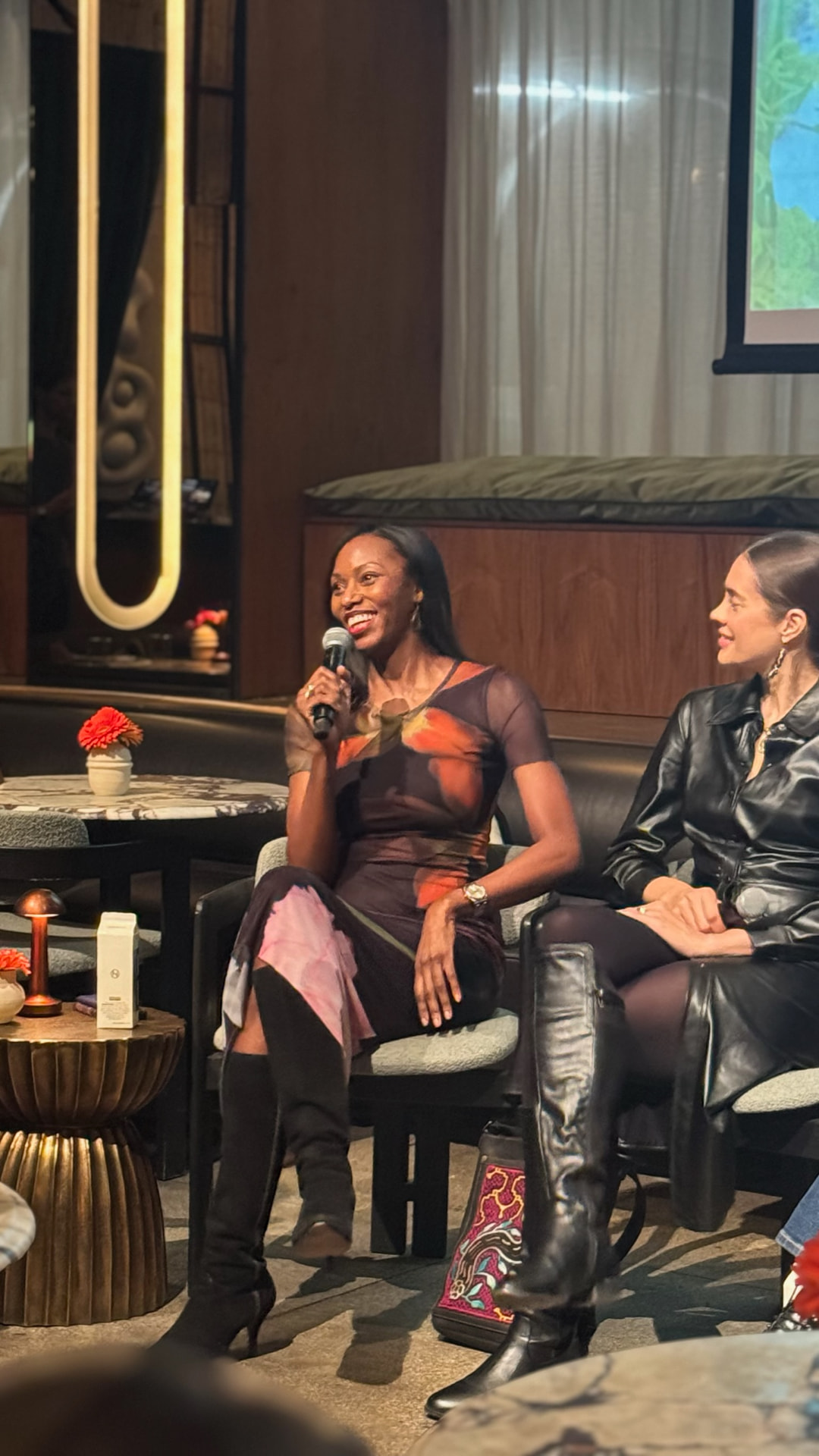 Kelle speaking during a seated panel conversation